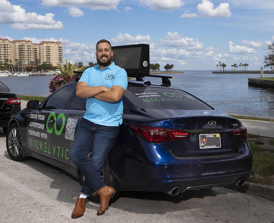 Judah Longgrear plans to expand services offered by his digital ad company, Nickelytics, from ad "wraps" on cars to digital rooftop ads.