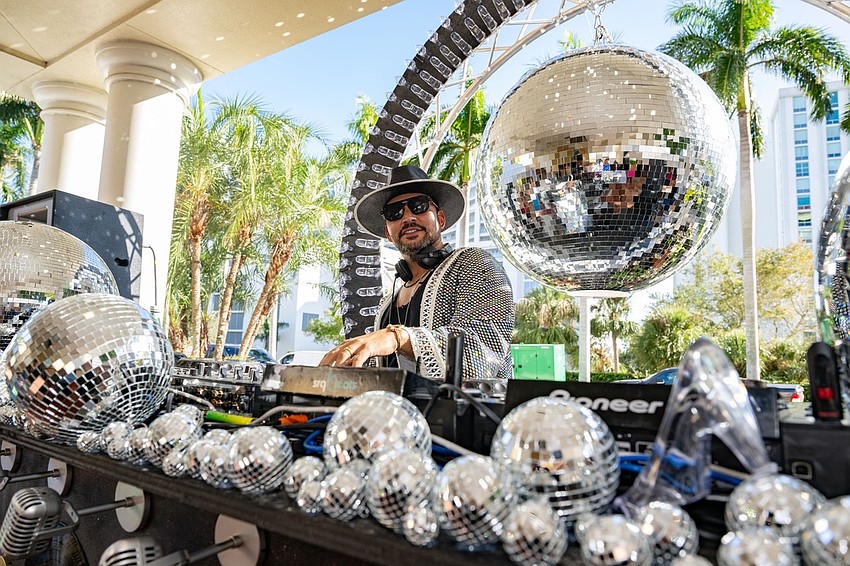 SRQ Beats DJ spins tunes at the afterparty.