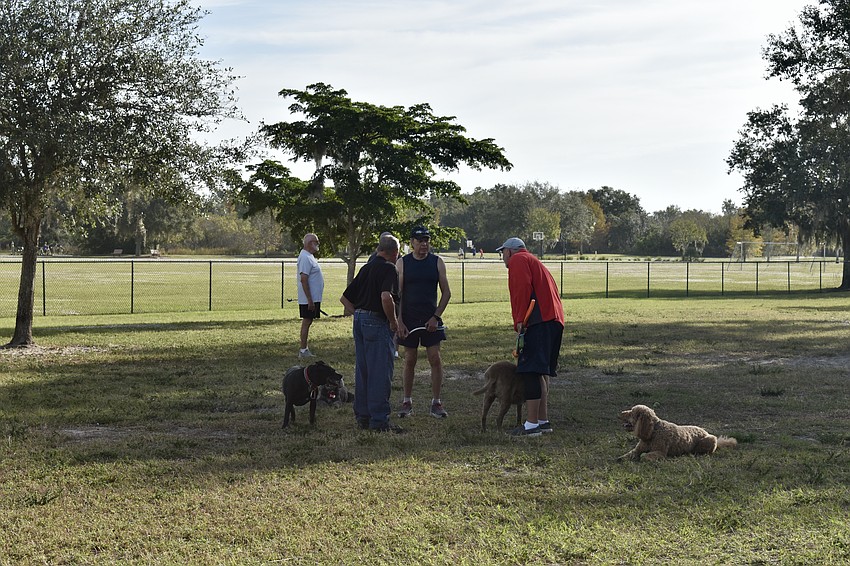 Neighbors meet daily at the Greenbrook Adventure Dog Park.
