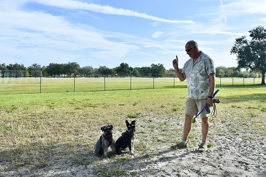 Tom Gwiazdowski gets Sadie and Maximilian Von Schnauzer to pose for a picture.