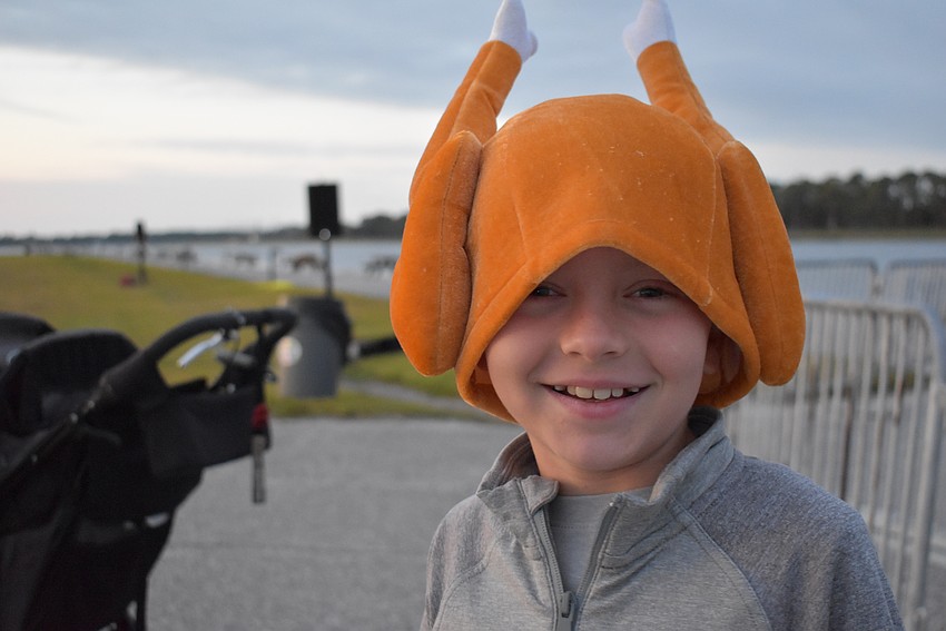 Ellenton 9-year-old Charlie Holleran decided to run the Florida Turkey Trot with a turkey on his head.