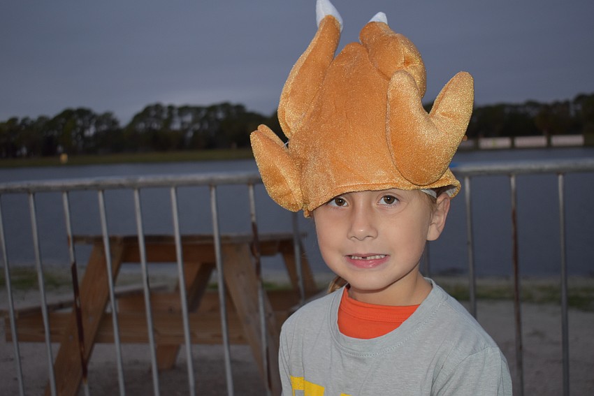 It was still dark when 5-year-old Misha McKee of Palmetto arrived at Nathan Benderson Park to run in the sixth Florida Turkey Trot.