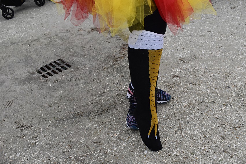 Donna Krusenoski of the Meadows in Sarasota said the runners who dressed up in last year's Florida Turkey Trot were having so much fun she decided to order a turkey hat and turkey leg socks after the race. She wore them this year.