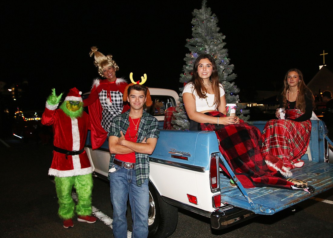 Chip, Kristy and Jacob Cerovac, and Addie Fern and Lana Sheridan, prepare for the 65th annual Gaslight Parade in Ormond Beach. Photo by Jarleene Almenas