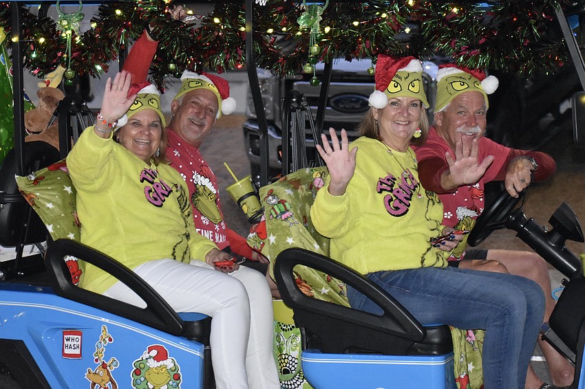 Debra and Gino LaMarca and Nancy and Richar Virgin head down the parade route.