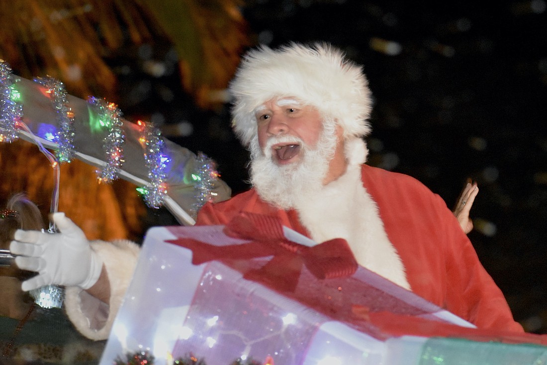 Santa Claus arrives on the Key Life Charters float.