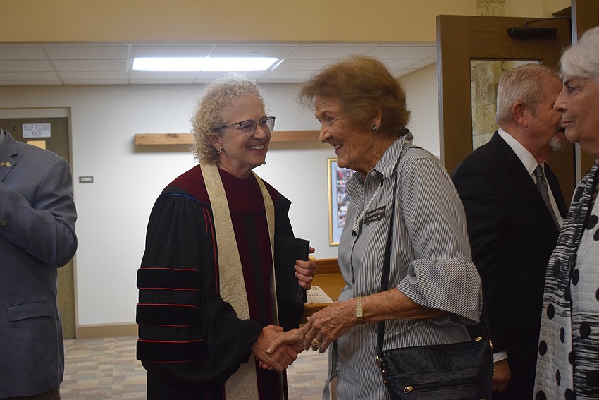 Rev. Juila Piermont greeting peoople after the service