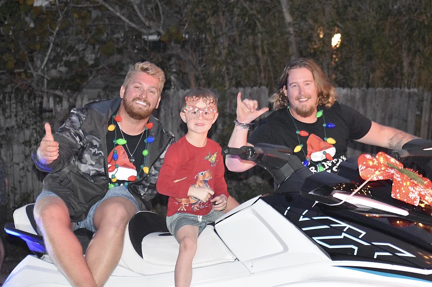 Marshall Germond; Reed Longenbach, 5; and Jared Green of Siesta Key Jet Ski ride Jet Skis in the parade.