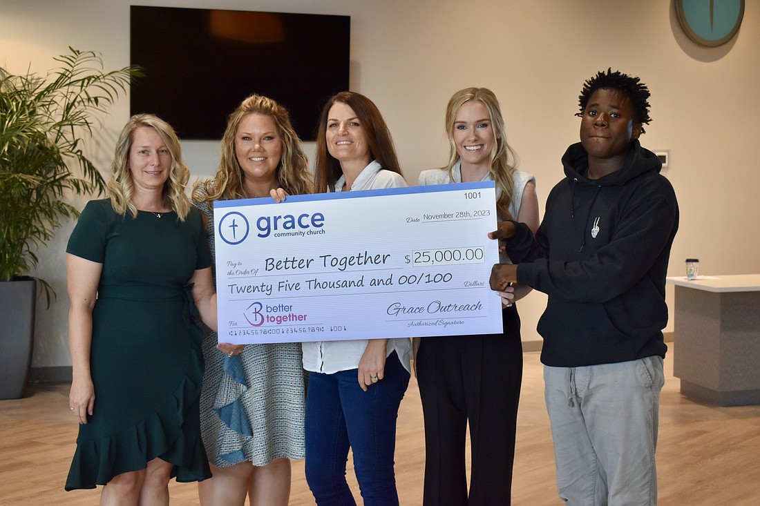 Bonnie Caulson, Jessica Braemer, Ellie Casebolt, Lora Bostick and Shadeed Wright are at Grace Community Church on Nov. 17. The church made a $25,000 donation to Better Together.