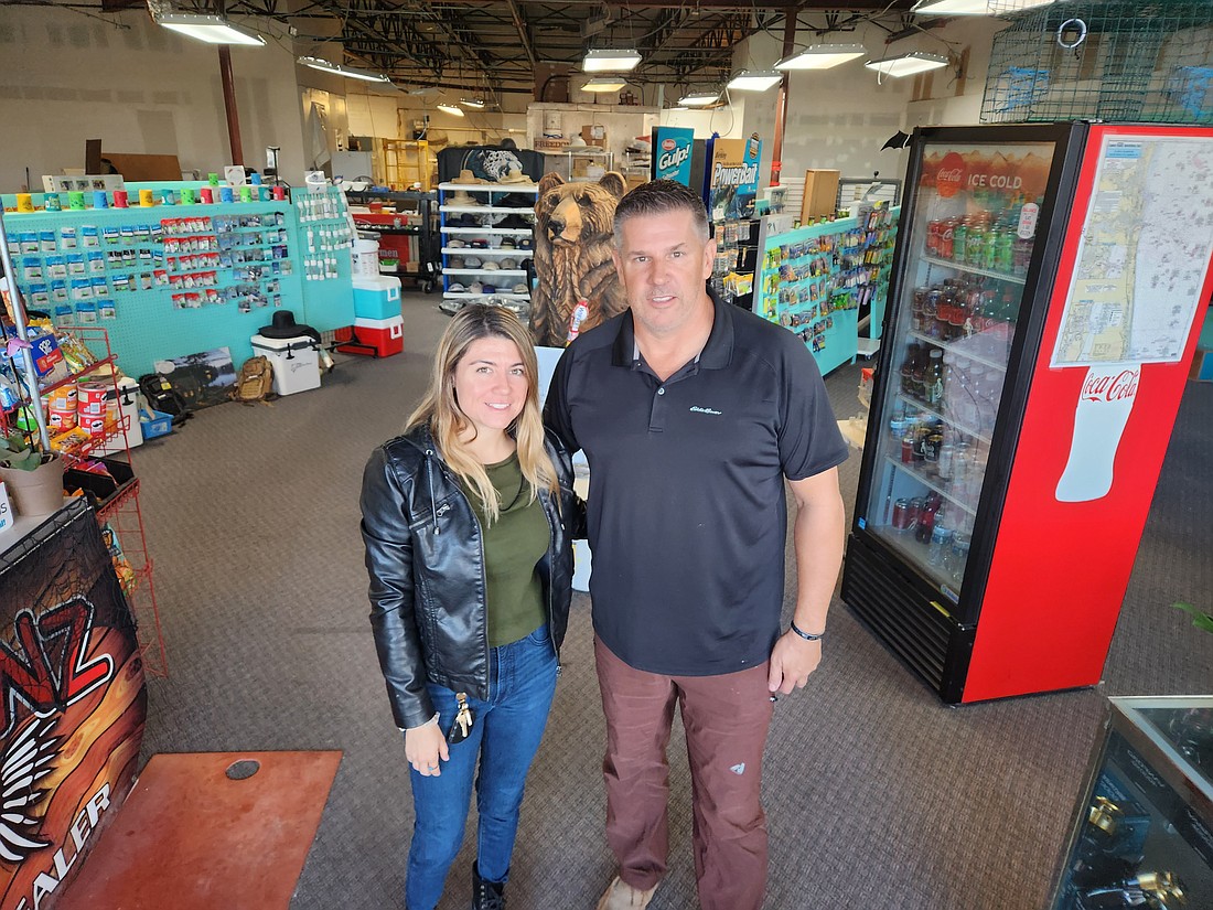Jessica Rodriguez and Dan Manjack inside Arlington Bait & Tackle Fishing shop at the College Park shopping center. Manjack, who became involved in the center’s renovation while working as a contractor, bought the shop as he became convinced of the potential for renewal in Arlington.
