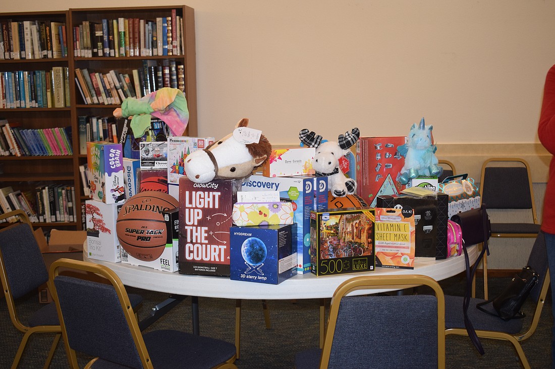 Rotary Club of Longboat Key donated gifts for children to Stillpoint Mission in Bradenton.