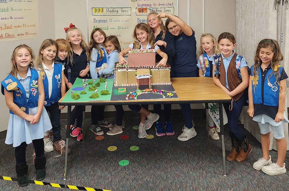Members of Girl Scout Troop 365 takes pride in their school so they decided to recreate Robert E. Willis Elementary School out of gingerbread.