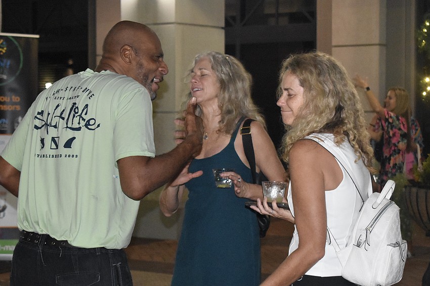 Michael Avery, Sherry Smith and Brandi Young dance together.
