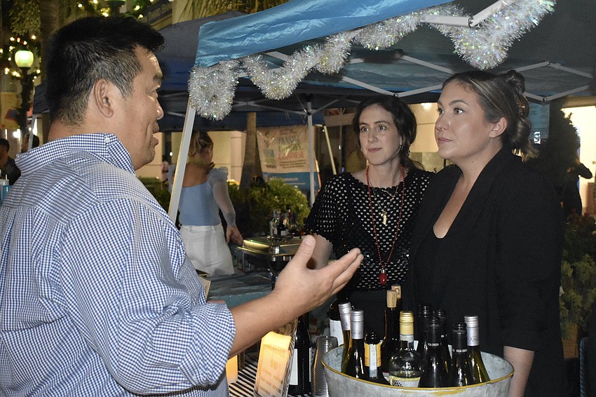 Bill Kwon talks with Carley Holtsinger and Brooke Levine of Sarasota Wine Co.