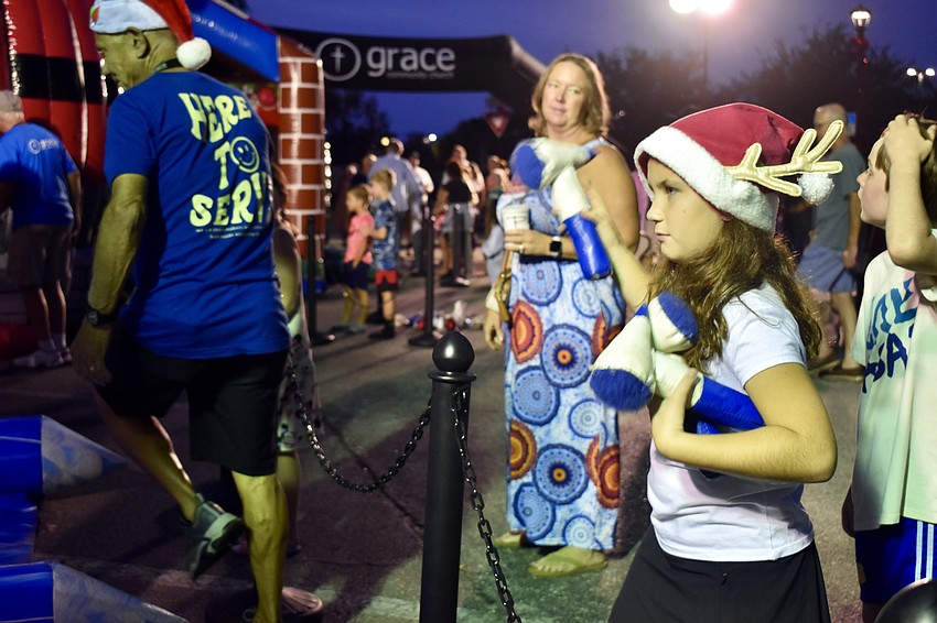 Molly Meyer is laser-focused at the Snow Throw, which is the winter, inflatable version of axe throwing.
