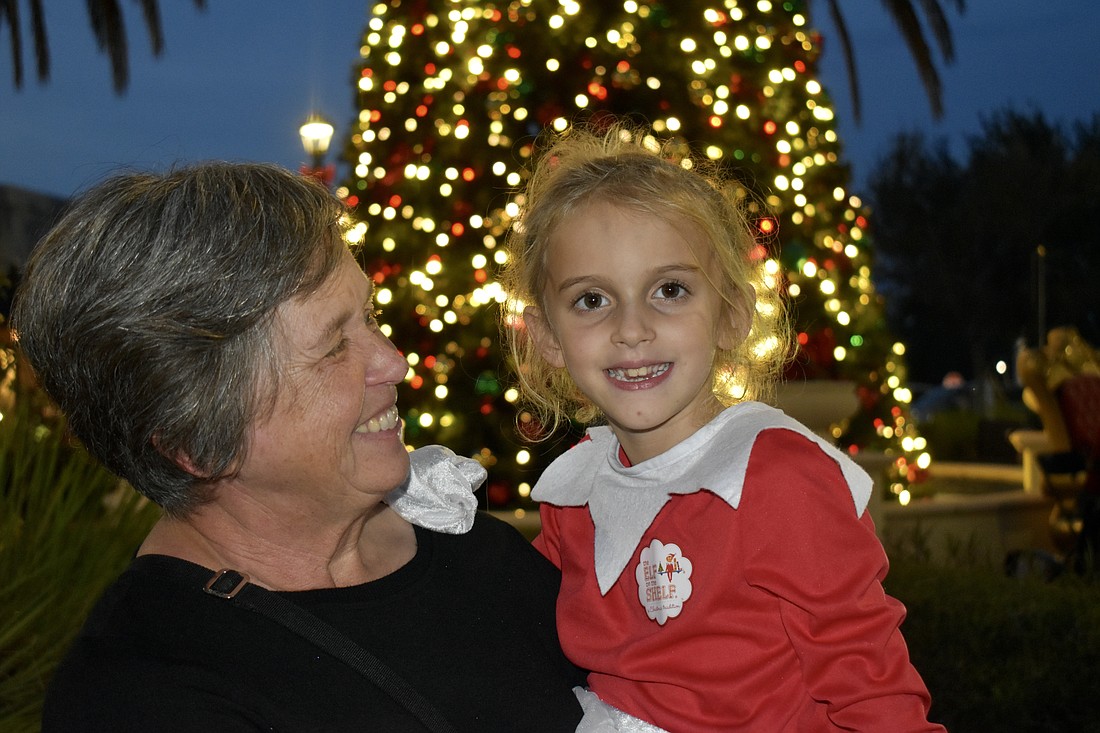 Karen MacDougall and her granddaughter Sloane Johnson love Music on Main, especially in December. Sloane is dressed as an Elf on the Shelf.