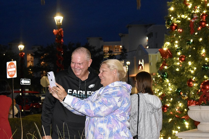 New Tara residents Janet and Bob Damron celebrate their first Christmas in Lakewood Ranch with a selfie in front of the newly lit Christmas tree on Main Street.