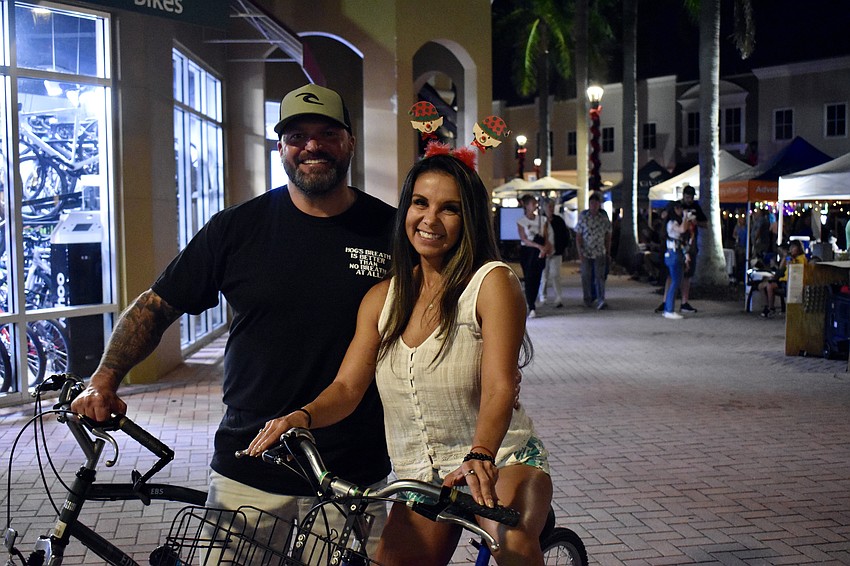 Edgewater residents Todd and Viviana Disney are on bikes because they know better than to try to get a parking spot for Music on Main.