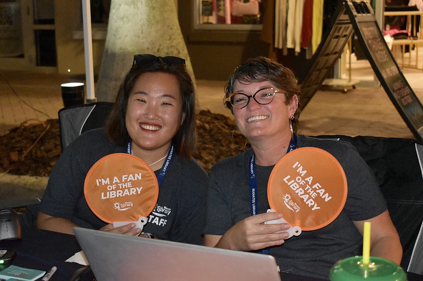 Assistant Branch Supervisor Callie Hutchison and Branch Manager Tiffany Mautino are signing residents up for library cards.