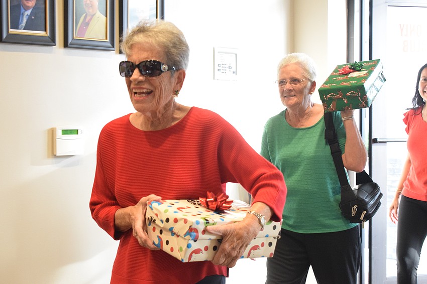 Lakewood Ranch's Bettie Reuter and Elaine Kaup are all smiles as they donate shoeboxes for Meals on Wheels Plus of Manatee.