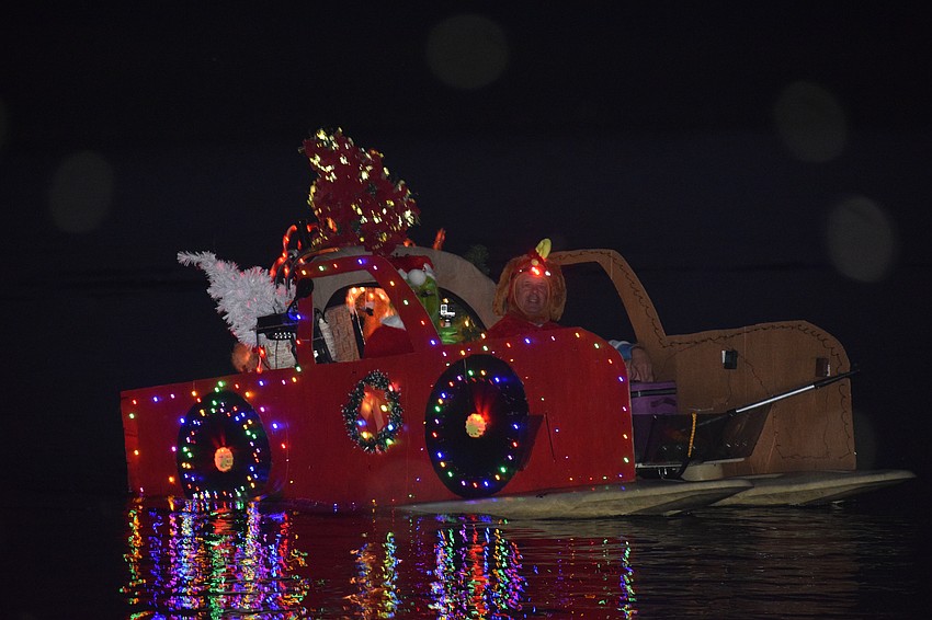 The Grinch and his dog Max make an appearance at Jiggs Landing during the boat parade, but don't worry, they aren't trying to steal Christmas.