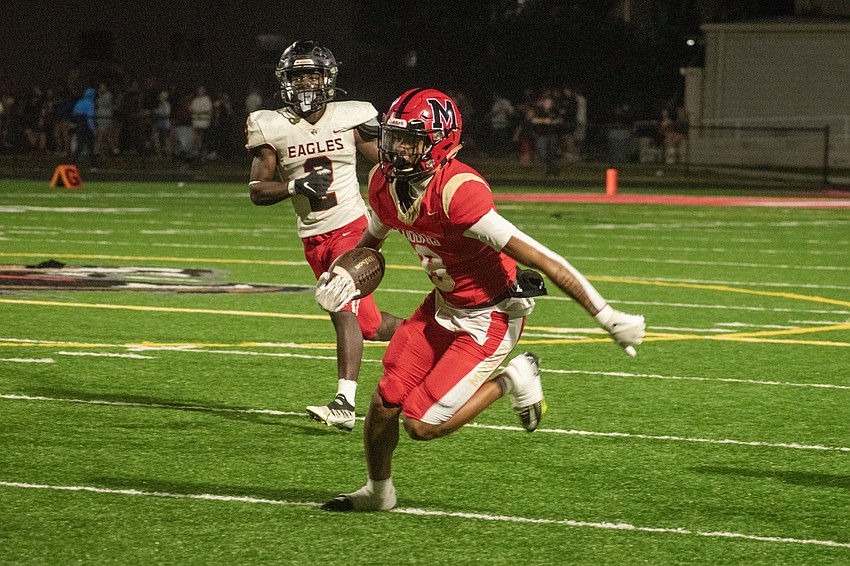 Mooney junior Chris McCorkle turns upfield after a catch.