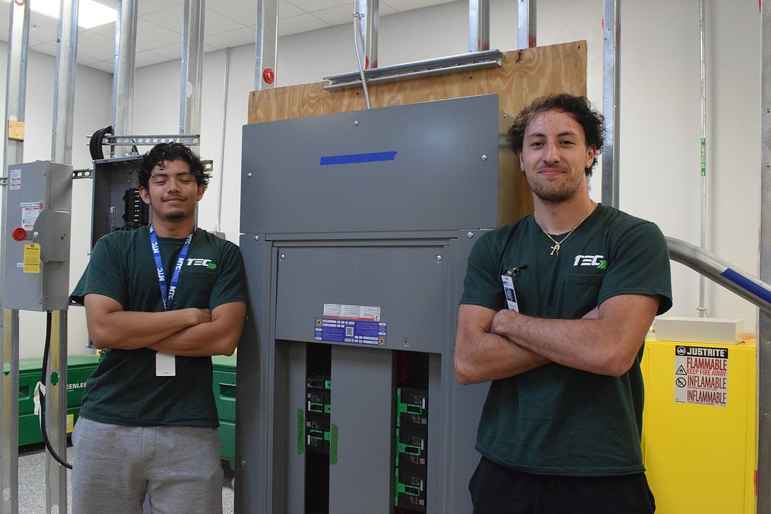 Andy Alvarenga and Frank Petrone appreciate the paid on-the-job training they receive and additional instruction they receive as part of their electrical apprenticeship with Manatee Technical College.