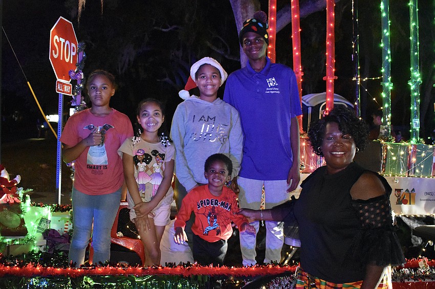 Apryl Habner, 10, Deniyla Brown, 7, Ulissa Habner, 12, Jionni Haill, 3, Nayland Giles, 13, and Dr. April Glasco, founder of Second Chance Last Opportunity