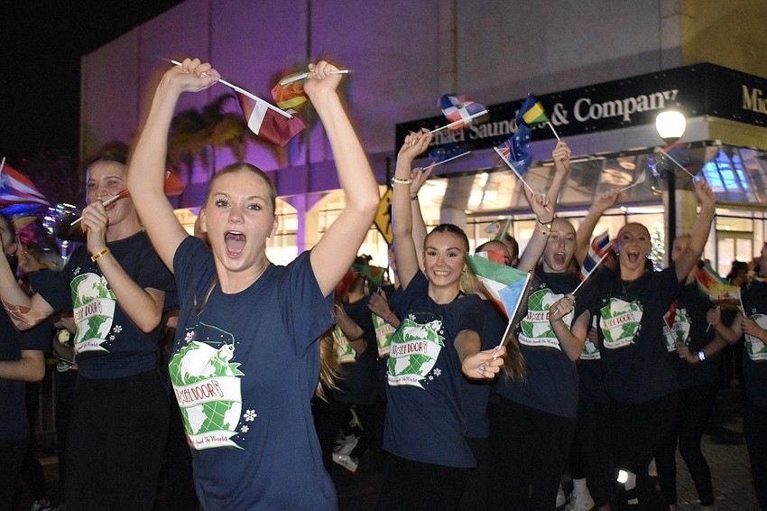 Stage Door Studios students wave the flags of various countries.
