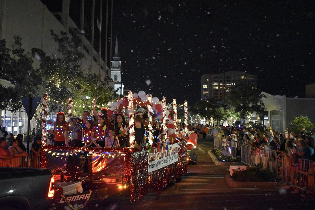 The Sarasota School of Arts and Sciences float makes its way down Main Street.