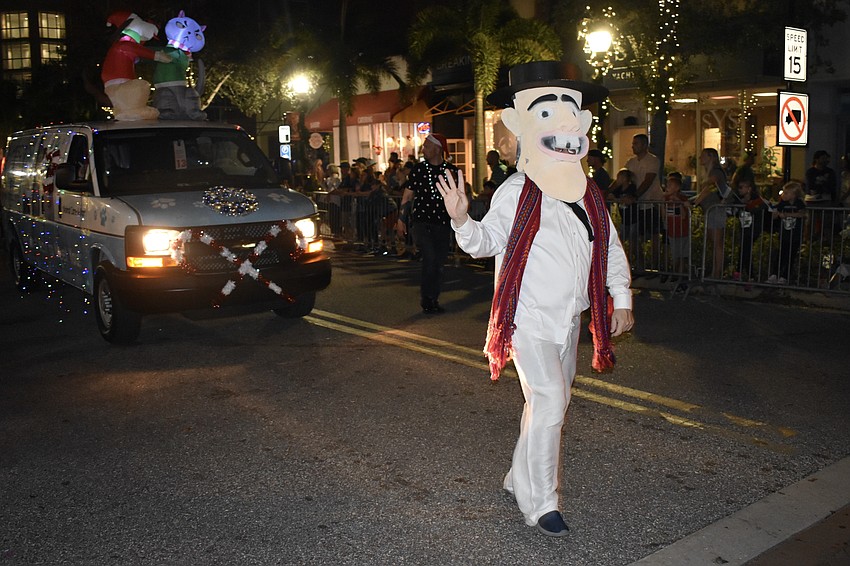 Jose Florez walks the parade with CreArte Latino Cultural Center.
