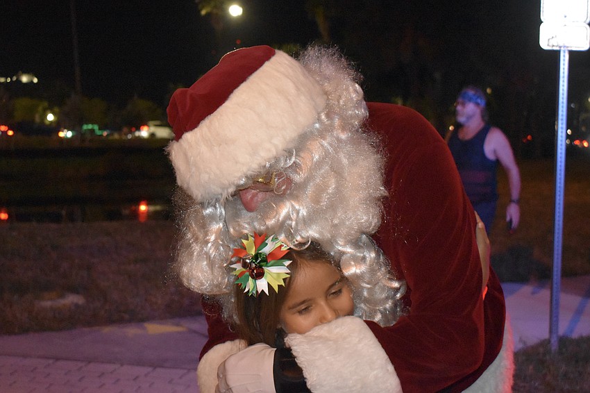 Aldana Vasquez, 7, meets Santa Claus.