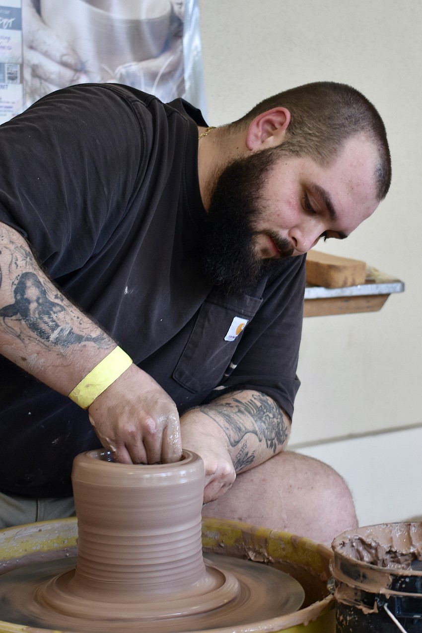 Brenden Deasy of Sarasota Clay Company offers a pottery demonstration.