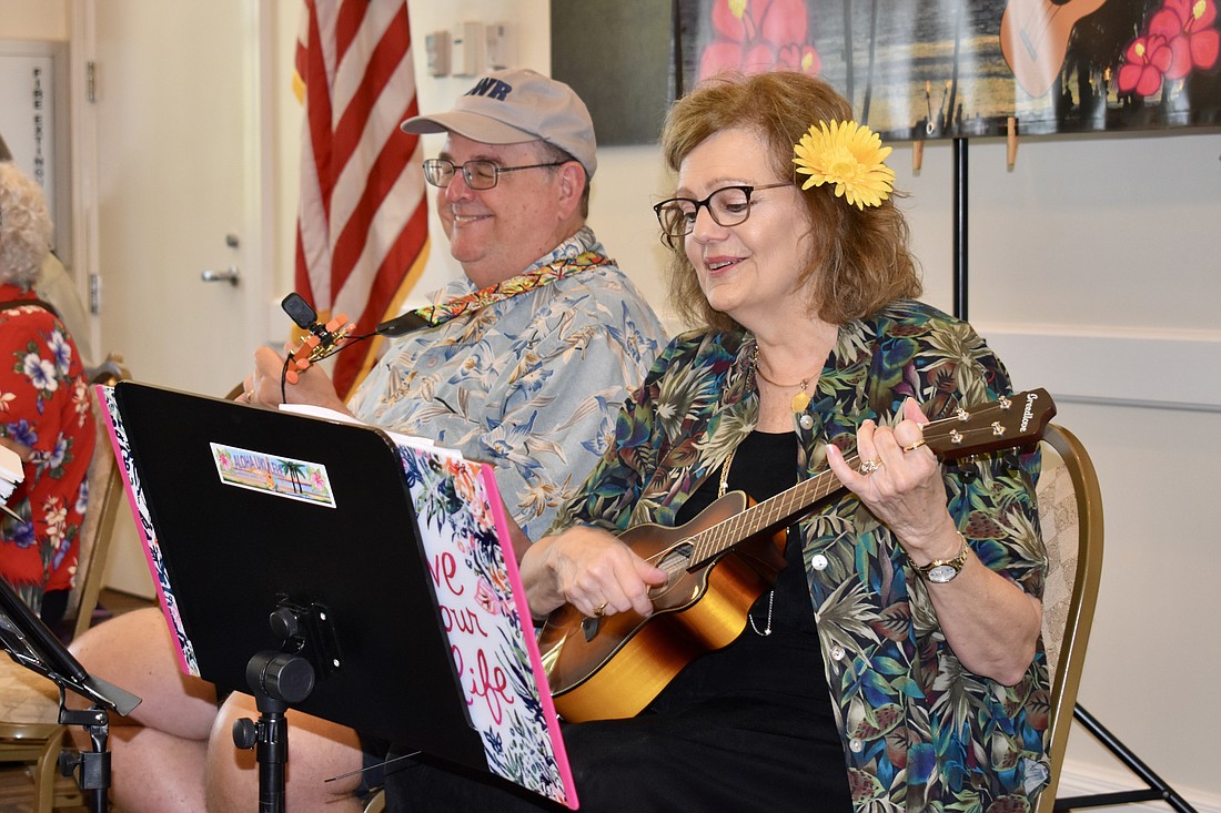 Carl Backman and Nancy Cunningham, members of Aloha Ukulele, perform with the Lakewood Ranch Community Activities  club for Play Music on the Porch Day on Aug. 26, 2023.