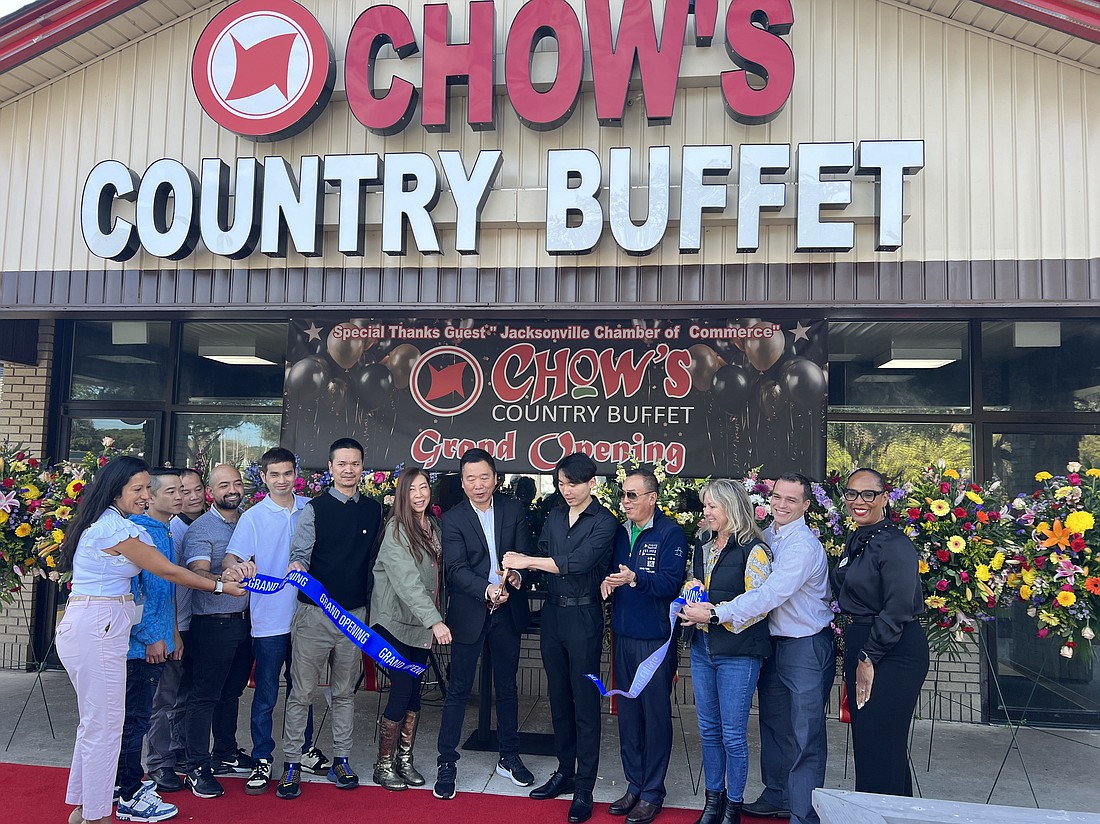 Members of the Chen family, owners of Chow’s Country Buffet, cut the ribbon Dec. 5 at the new restaurant at 4250 Southside Blvd. between Touchton and Hogan roads near Tinseltown.