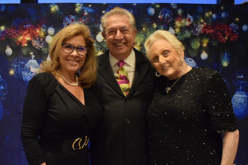 River Club's Lynn Hague and Bob and Pearl Taboh ring in the holiday season together at River Club's first Jingle Ball.