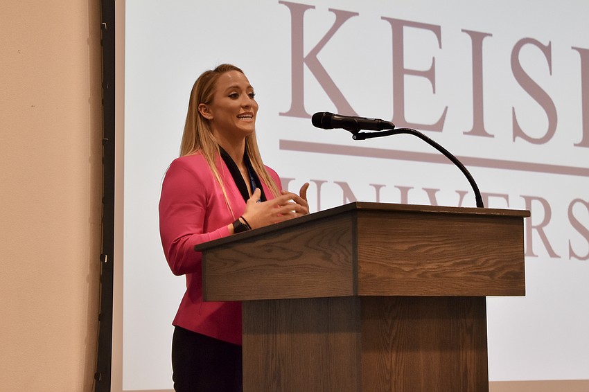 Meghan Byrd, a senior admissions counselor at Keiser University, one of the event's sponsors, speaks at the event.
