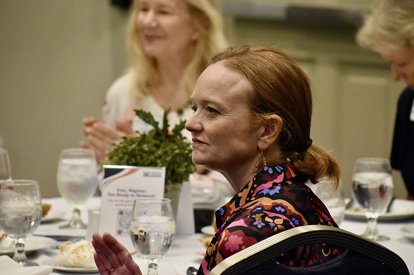 Susie Bowie listens to Terry Connor's presentation.