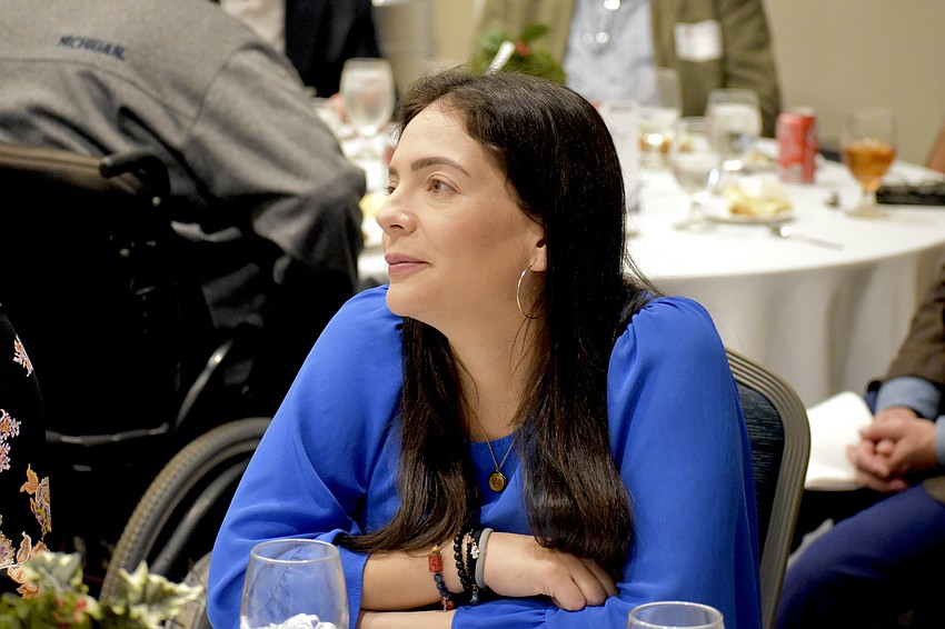 Daniela Miartus listens to Superintendent Terry Connor's speech.