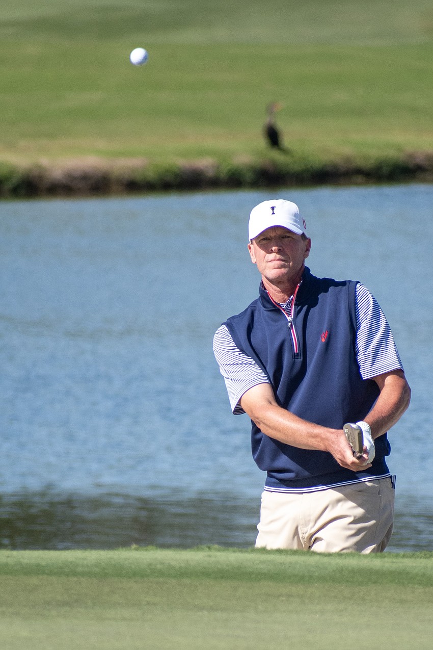 Steve Stricker his a ball onto the green on the No. 9 hole at The Concession Golf Club. He and teammate Billy Andrade would par the hole during the Six Ball session on day one of the World Champions Cup.