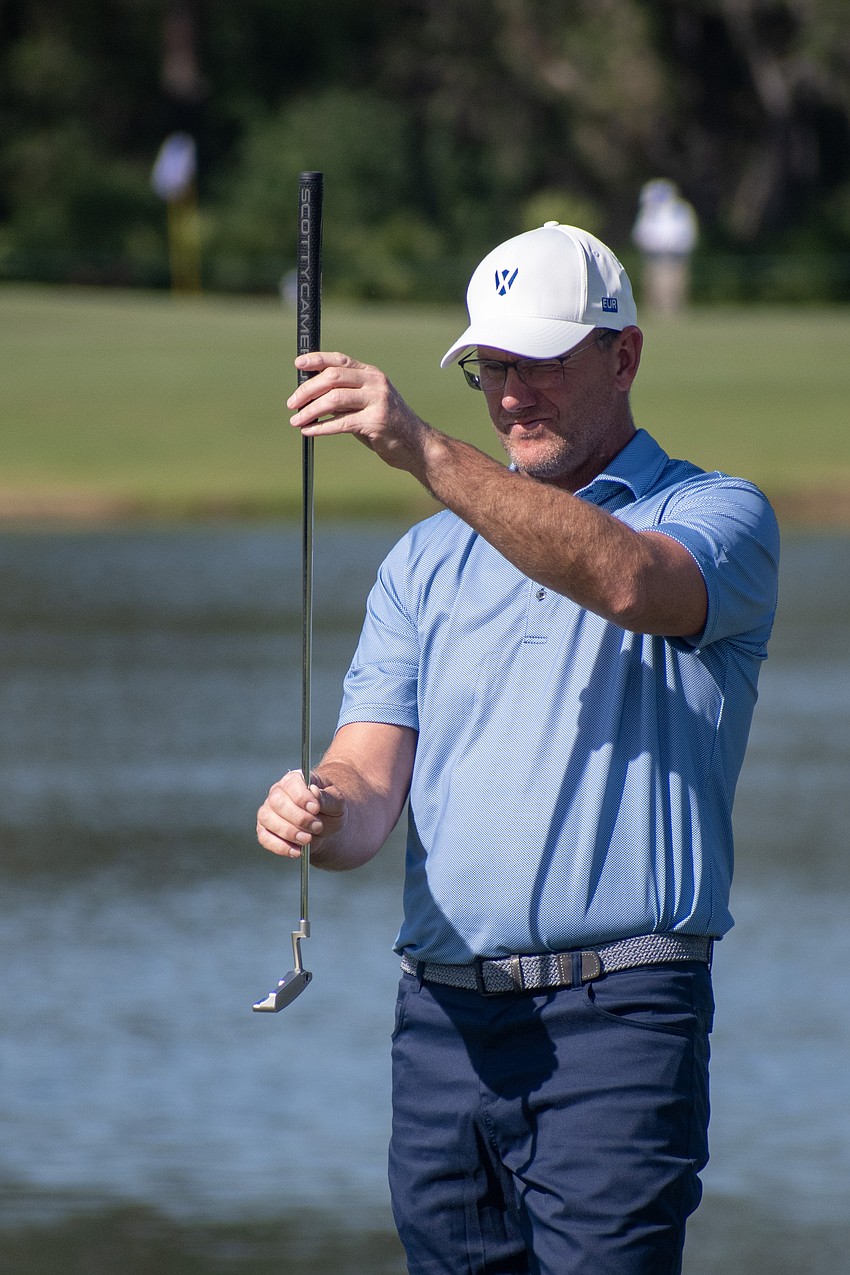 Team Europe's Robert Karlsson tries to find the line for his putt on the No. 9 hole at The Concession Golf Club during the Six Ball session Thursday.