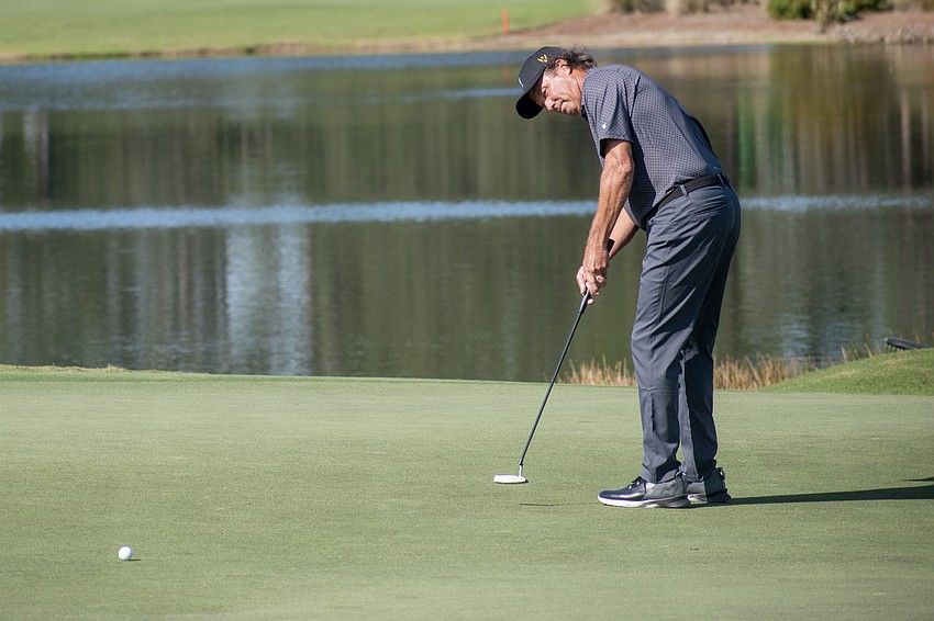Team International's Stephen Ames putts on the No. 9 hole at The Concession Golf Club during the Six Ball session of day one of the World Champions Cup. Ames and teammate Vijay Singh birdied the hole.