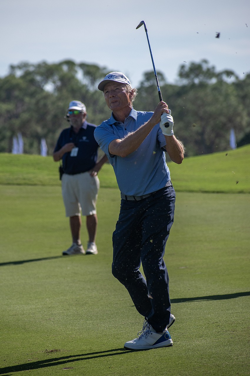 Team Europe's Bernhard Langer hits an approach shot on the No. 1 hole at The Concession Golf Club during the Scotch Sixsome session of day one of the World Champions Cup. Langer and teammate Alex Cejka would birdie the hole.