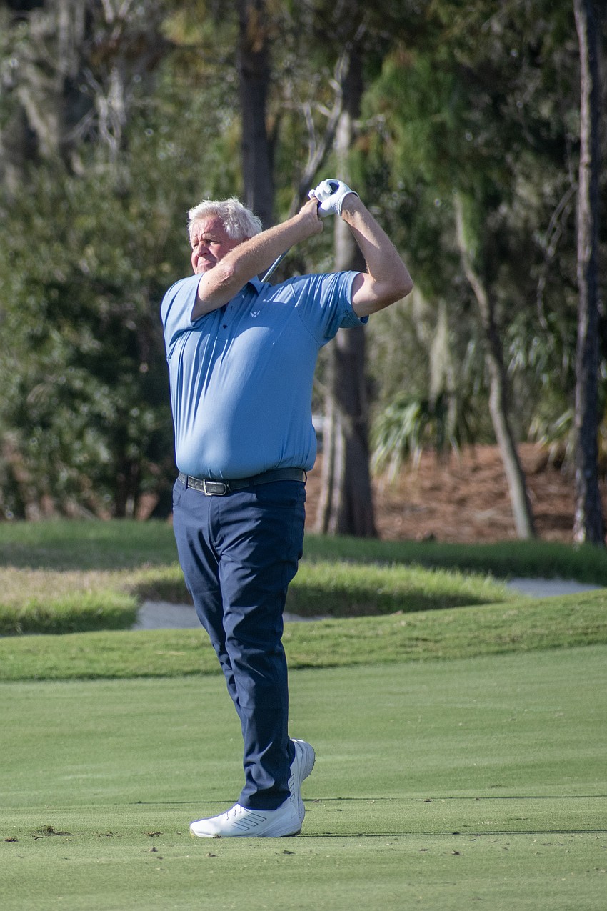 Team Europe's Colin Montgomery hits a shot on the No. 9 hole at The Concession Golf Club during the afternoon Scotch Sixsome session of day one of the World Champions Cup. Montgomery and teammate Darren Clarke earned eight points during the session.