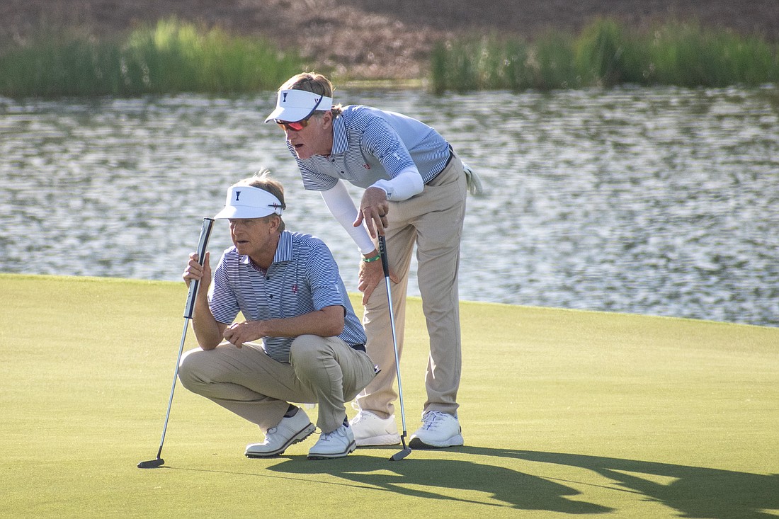 Team USA's David Toms and Brett Quigley look over the green on the No. 9 hole at The Concession Golf Club. The pair earned nine points for Team USA during the Scotch Sixsome session on day one of the World Champions Cup.