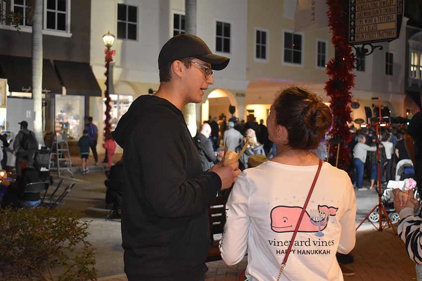 Gannon Weiner and Katerina Maslowski share a laugh and some falafels.