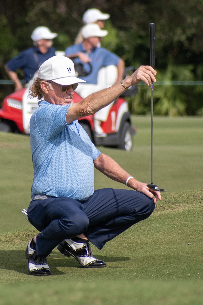 Team Europe's Miguel Angel Jimenez eyes up a putt on the No. 8 hole at The Concession Golf Club on day two of the World Champions Cup. Jimenez and teammate Robert Karlsson would birdie the hole during the day's Six Ball session.