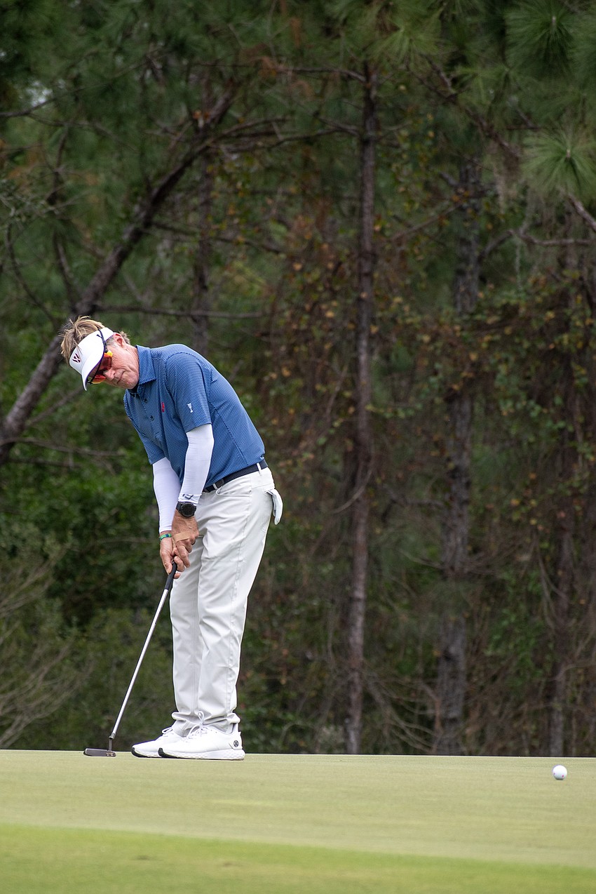 Brett Quigley putts on the No. 4 hole at The Concession Golf Club on day two of the World Champions Cup. Quigley and teammate David Toms would bogey the hole during the day's Scotch Sixsome session.