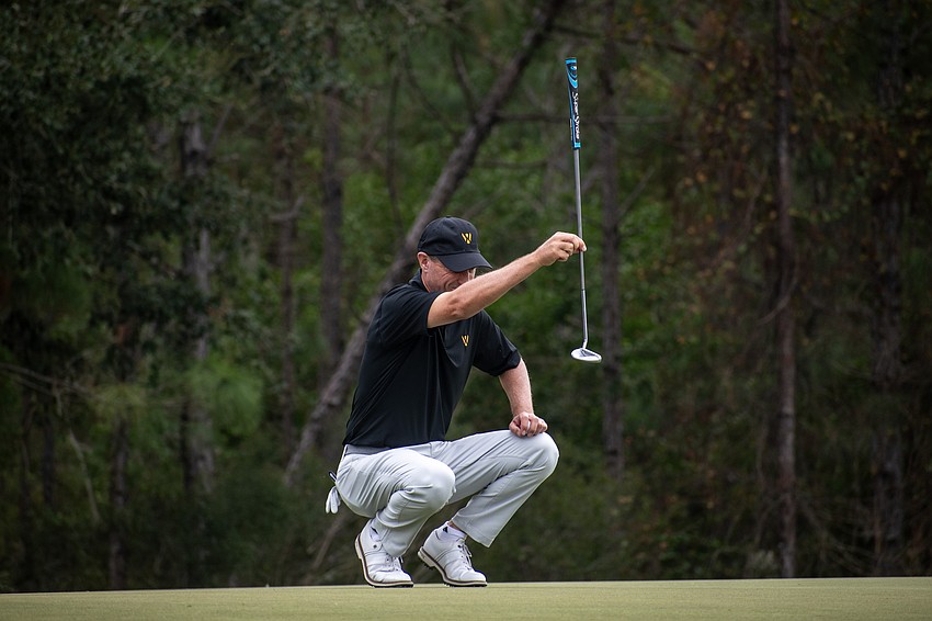 Team International's Steven Alker lines up a putt on the No. 4 hole at The Concession Golf Club on day two of the World Champions Cup. Alker and teammate Retief Goosen would birdie the hole during the day's Scotch Sixsome session.
