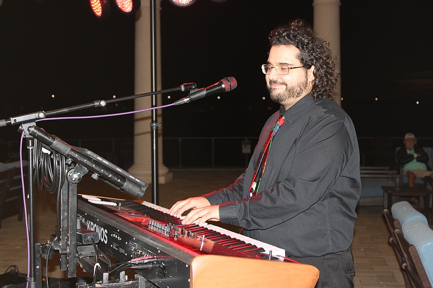 Mark Mayea plays for the Bay Kings Band during the block party Friday night at Waterside Place.